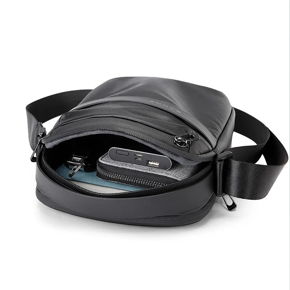 Morral antirrobo negro Bange para hombre y compartimentos organizados.